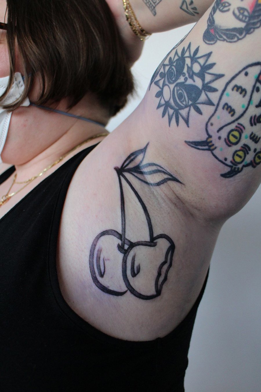cherries cherry under arm armpit tattoo bold mag drag Jacqueline may tattoo art black and grey toronto artist.jpeg