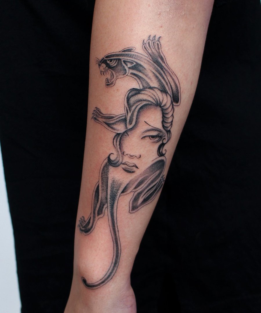 crawling panther lady face arm Jacqueline may tattoo art.jpeg