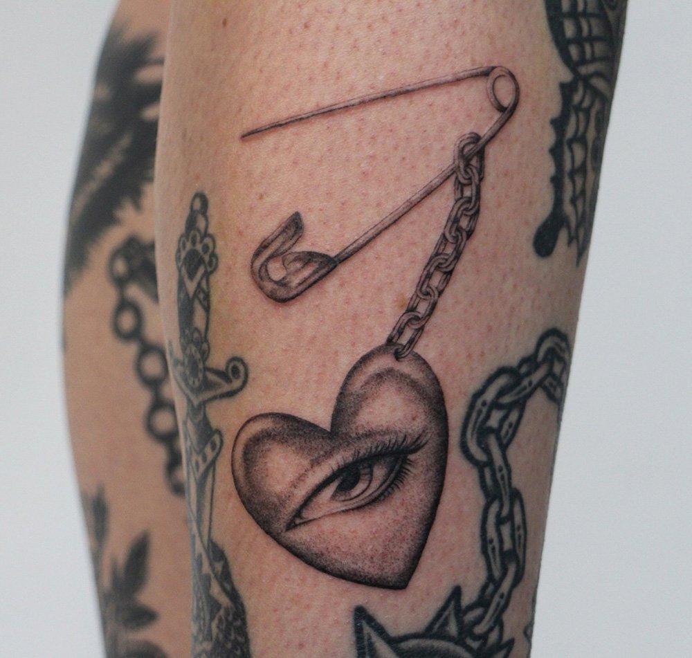 eye heart safety pin single needle fine line delicate Jacqueline may tattoo art black and grey toronto artist.jpeg