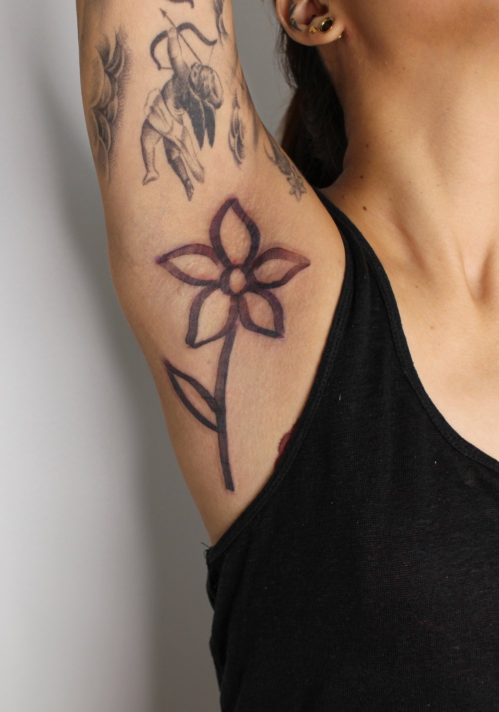flower minimalist bold mag drag Jacqueline may tattoo art black and grey toronto artist.jpeg