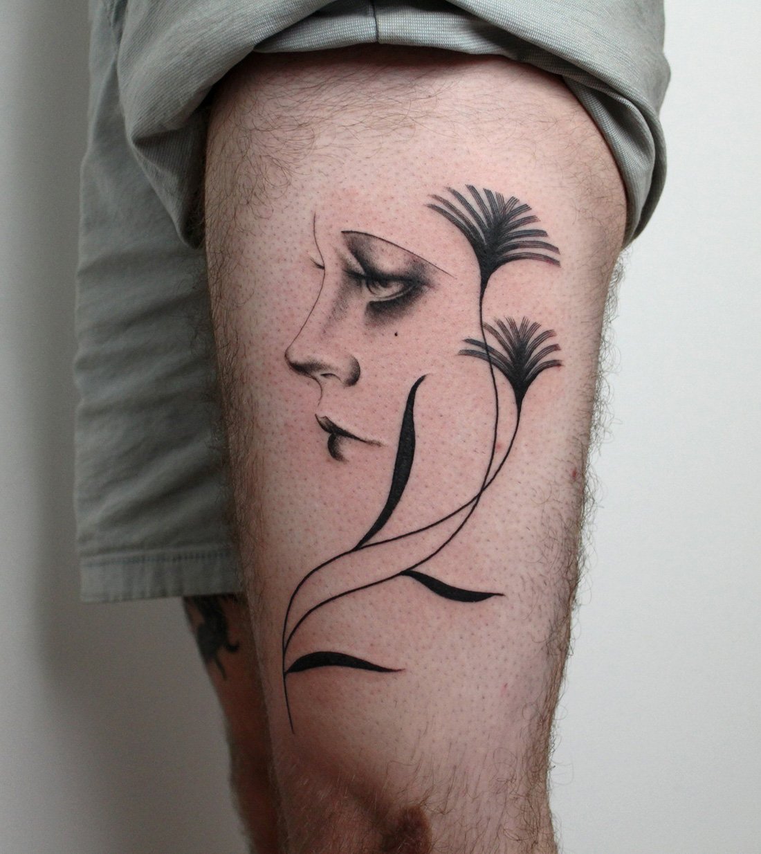 male leg female face delicate plant Jacqueline may tattoo art.jpeg