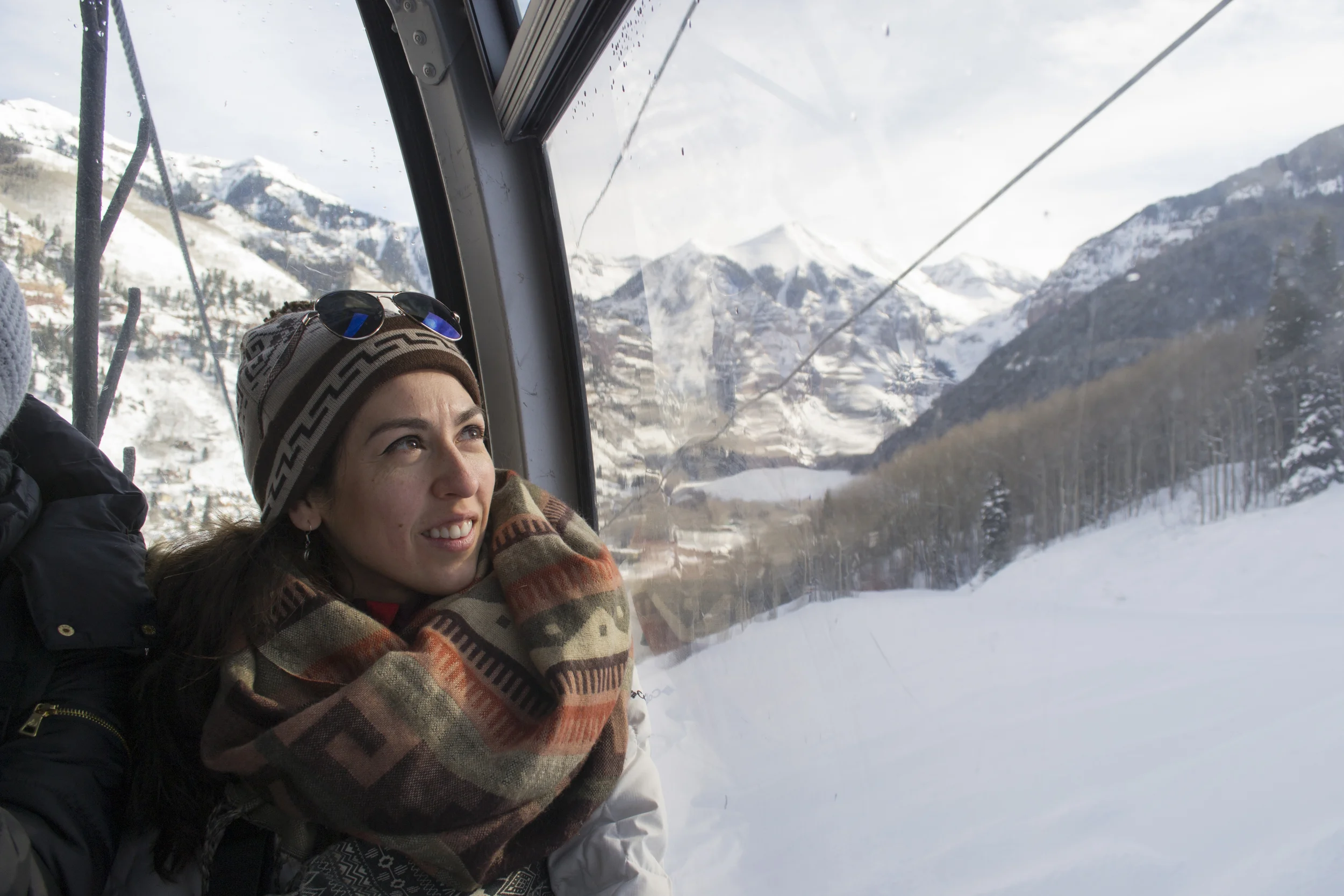 Light Grey Founder, Lindsay Nohl glaces out the gondala window as she sees mountains for the first time!