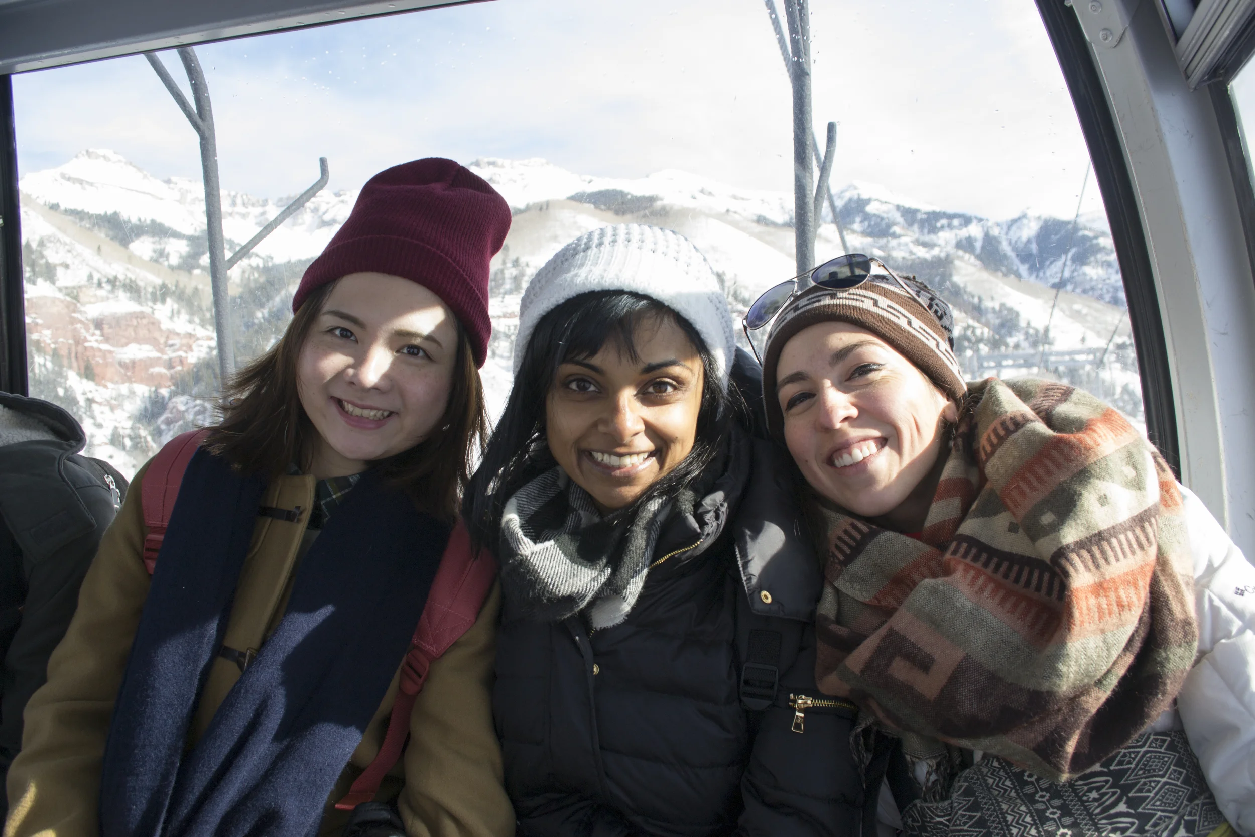 Yinfan, Anuja, and Lindsay ride the gondola from Telluride to Mountain Villiage.