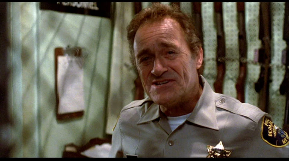 In the land of the beatnik, the half-brained sculptor is a cop.