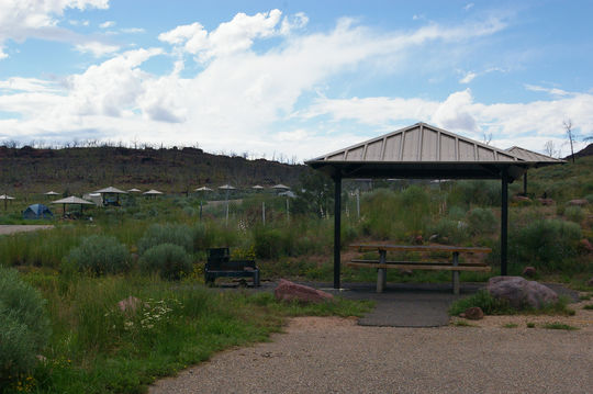 Covered tables and fire rings provided