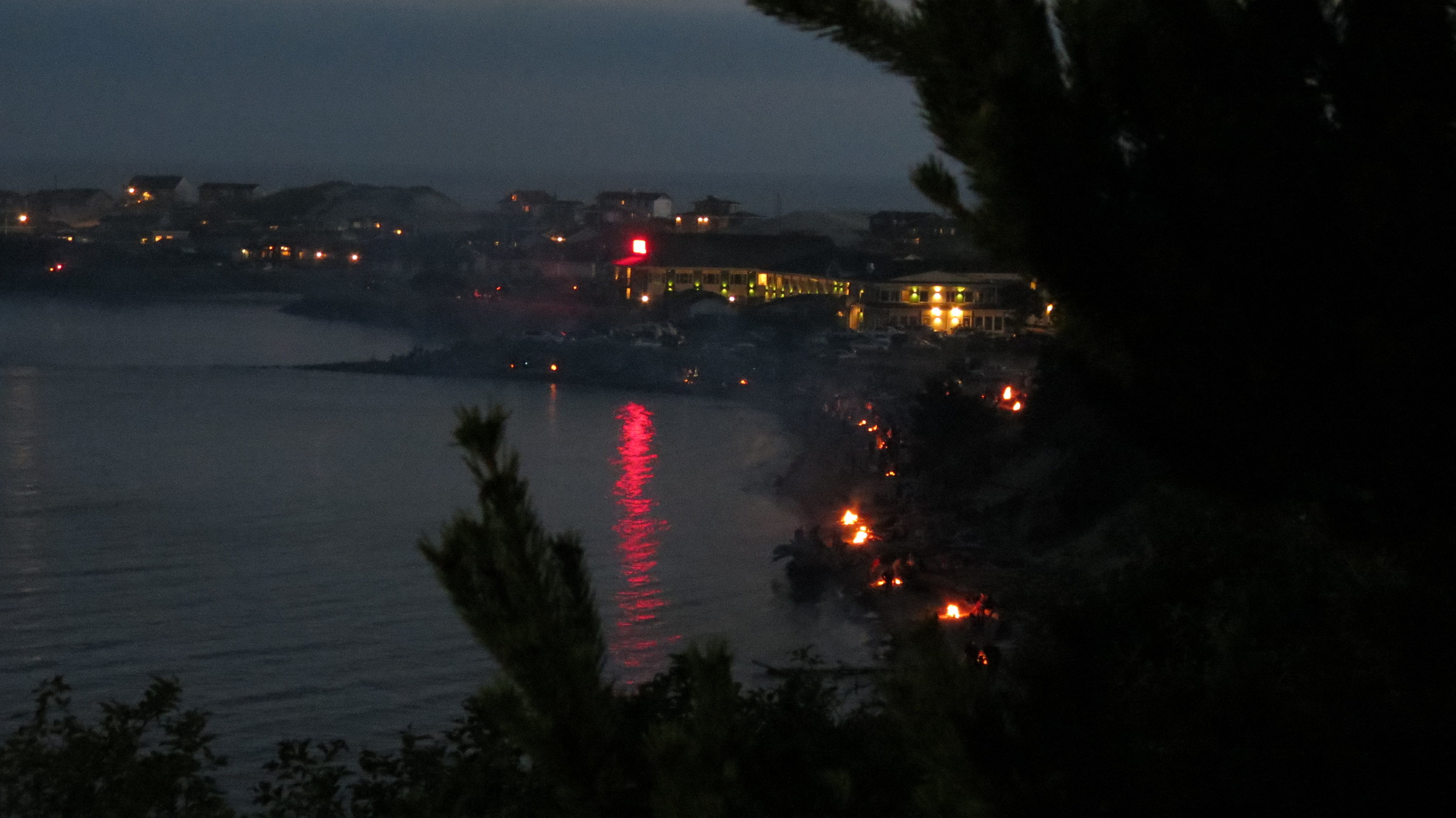 Alsea Bay lined with campfires