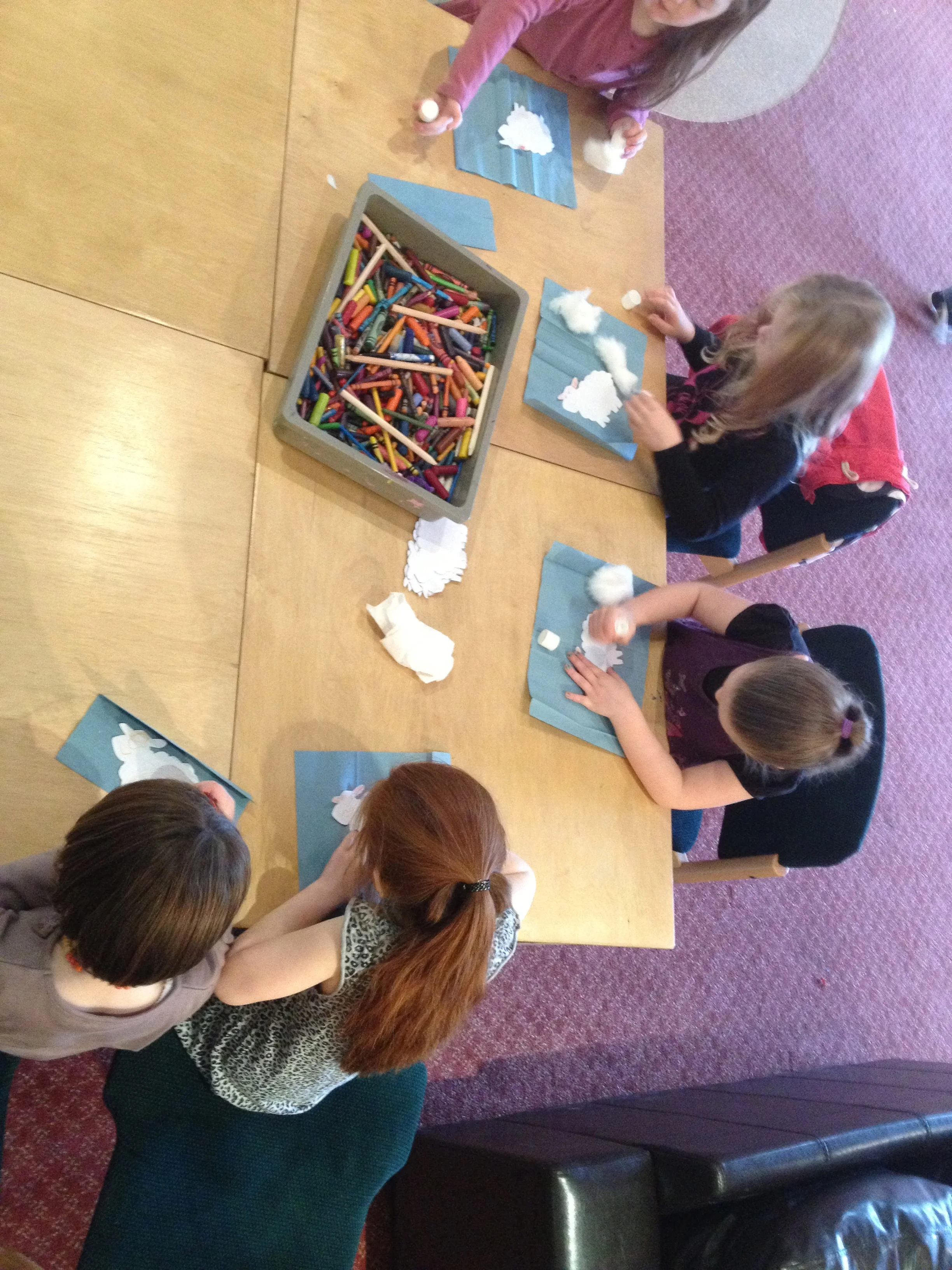 Children busy making their own little sheep at the crafts station.