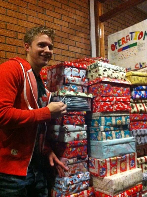 Scott helps to finish packing the final few and pile them up ready for collection.