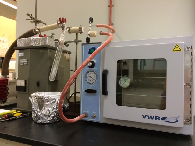 Vacuum oven and solvent trap for synthesis hood