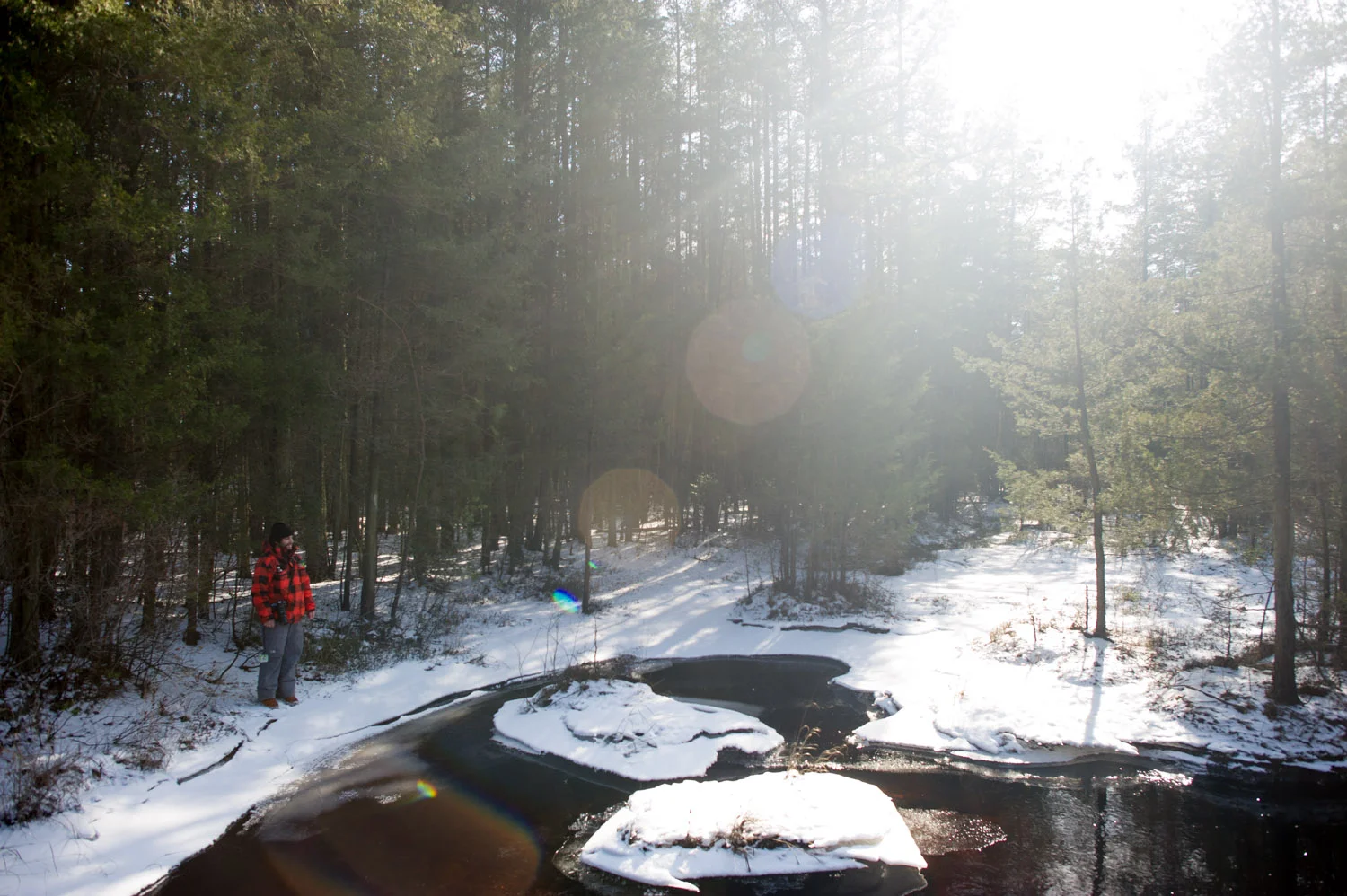 My friend Jesse standing on the edge of the icy river. Taken at Wharton State Forest in the NJ Pine Barrens.