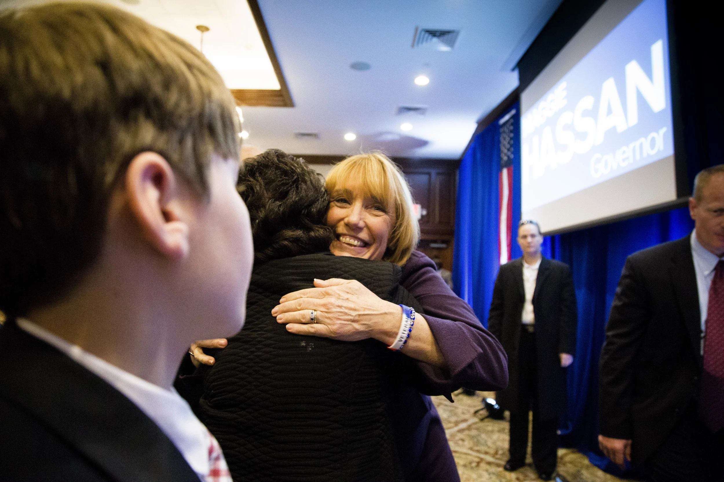 Manchester, NH, USA. Nov.4, 2014. Maggie Hassan wins New Hampshire Governor Race. A supporter give her a hug before she goes on stage and made a victory speech. Photo by Ann Wang