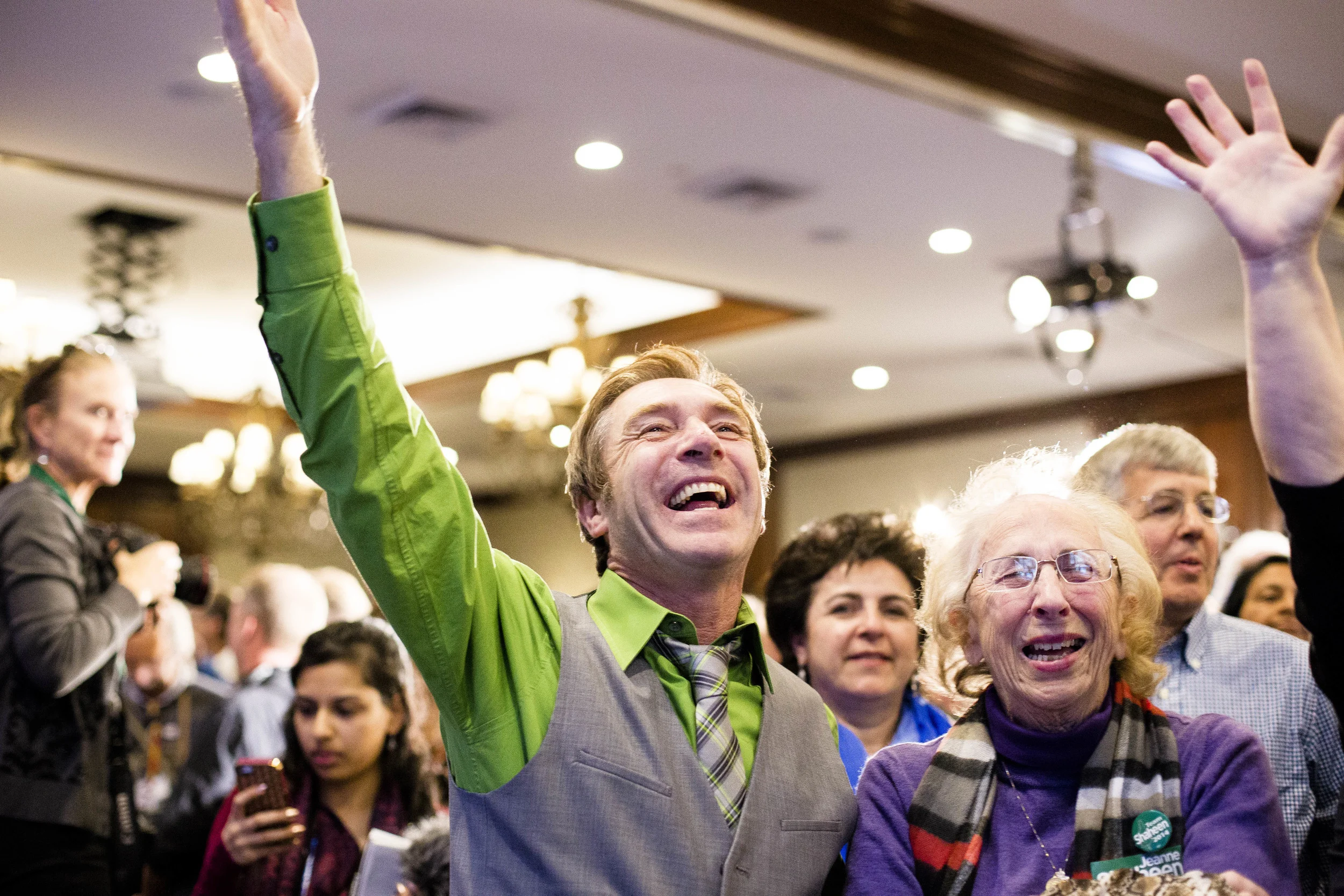 Manchester, NH, USA. Nov.4, 2014. Peggy Shaheen(center), 81 and Kevin Fennelly (left) cheers after Shaheen won the Senate Seat. Photo By Ann Wang
