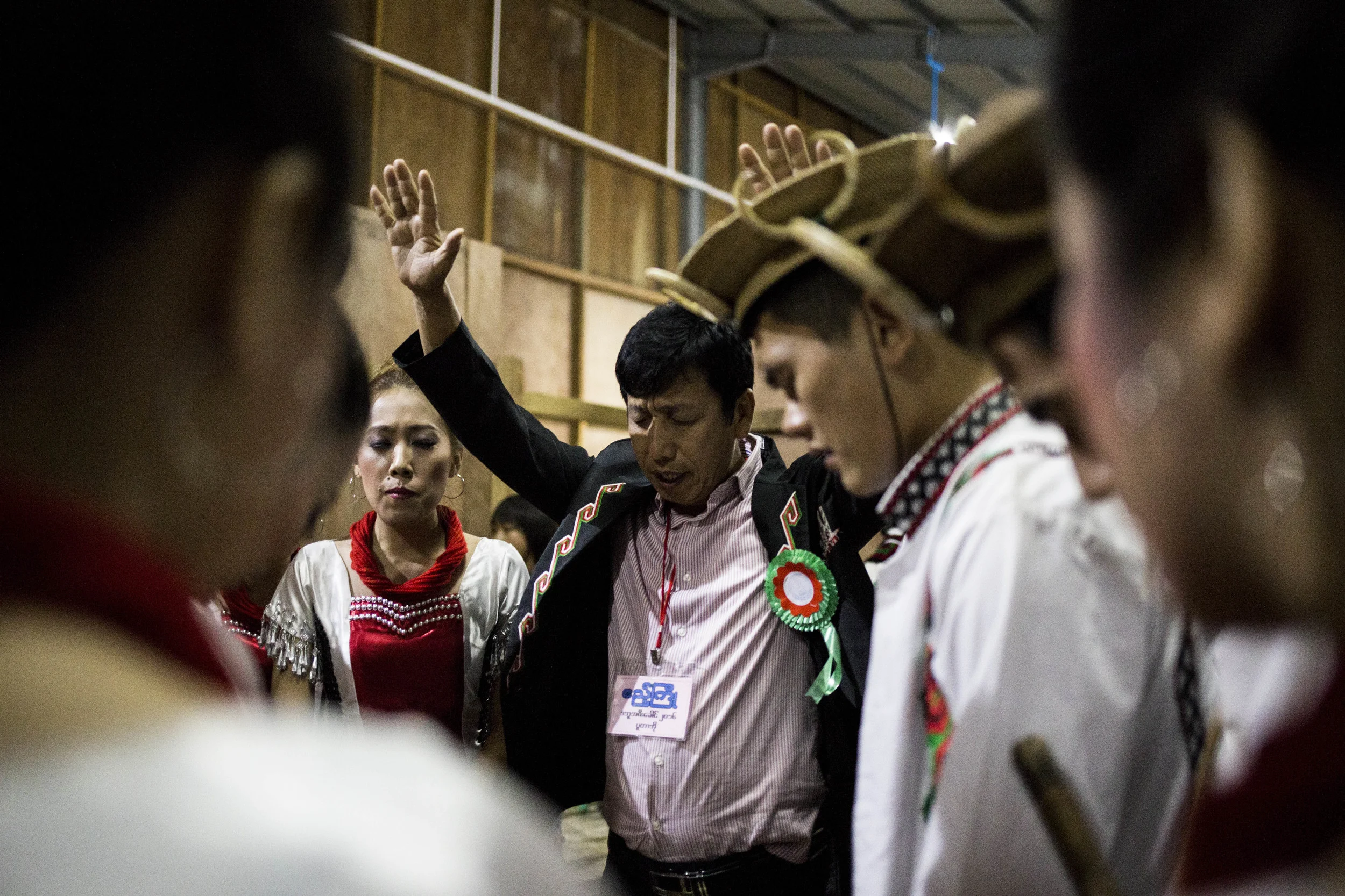 Prayers before going on stage. Photo by Ann Wang
