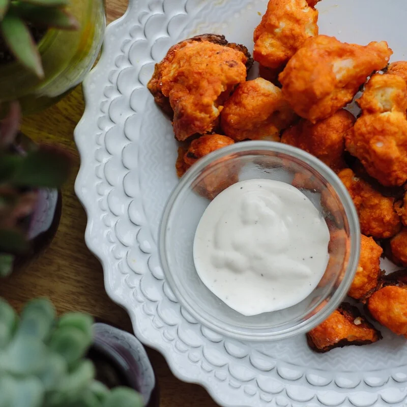 I stole this from a friend... Buffalo cauliflower. Dry cauliflower, egg wash, flour wash, dunk in Frank's Red Hot Buffalo sauce ... Bake! Probably crossed out the healthy points with that hidden valley ranch dressing. It's the only way.