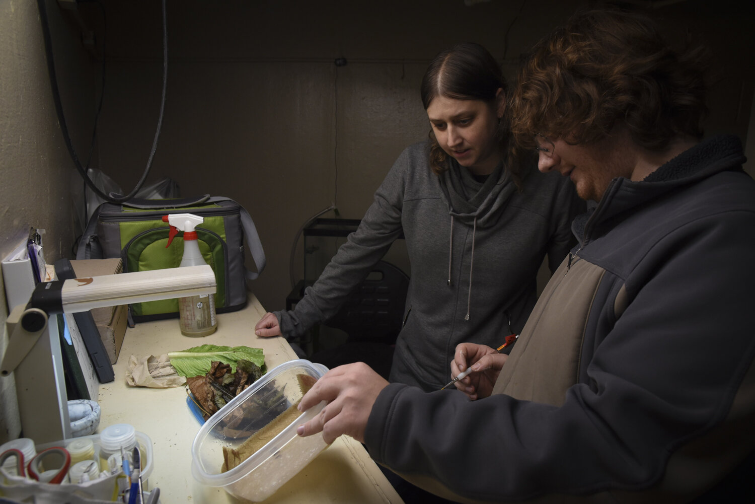  Cody Gilbertson and Ashton Yost discuss the snail population at the Rosamond Gifford Zoo in Syracuse, New York where part of the captive breeding snails are raised. 