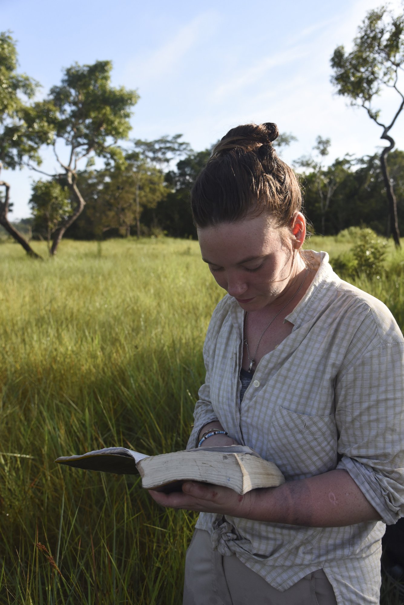  Maisie McNeice studies the Birds of Peru guidebook, while helping birder Yohamir Casanca Leon conduct a Global Big Day bird count in Bahuaja-Sonene National Park, a grassland on the border of Peru and Bolivia. 