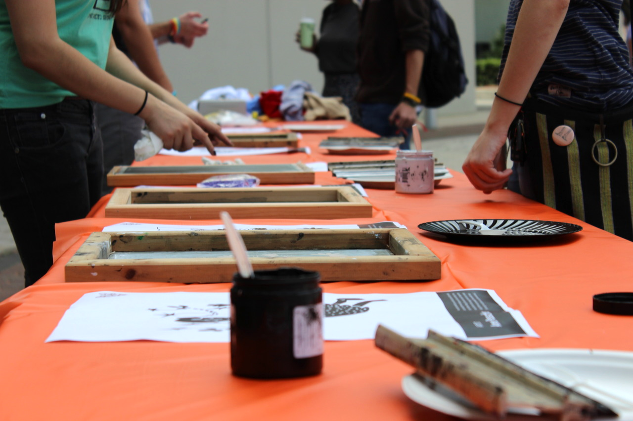 Nine artists, both students and alumni, submitted designs to be printed onto donors' shirts. 