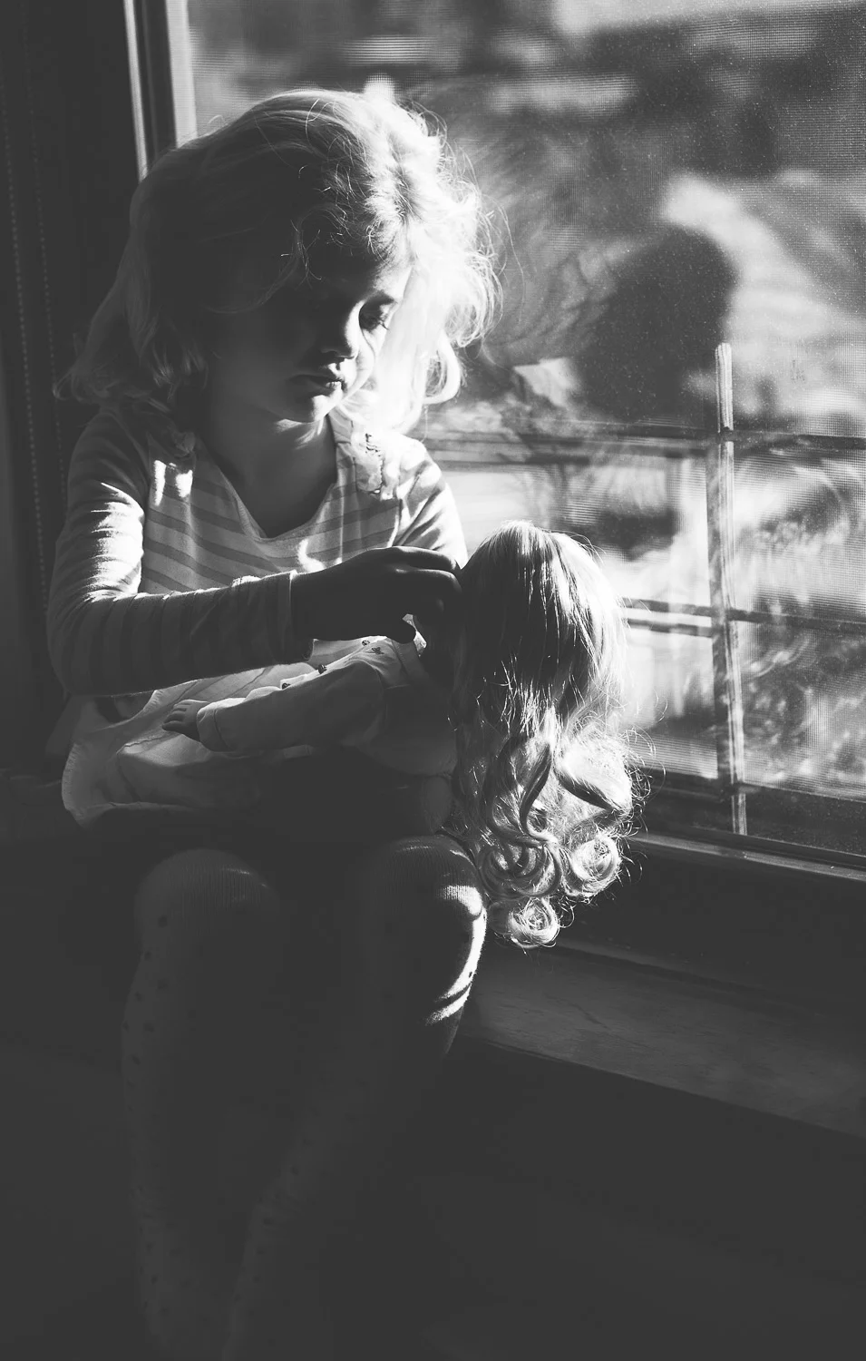 A little girl and her doll