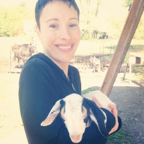 Sleepily (I just woke up) hanging with a baby goat.