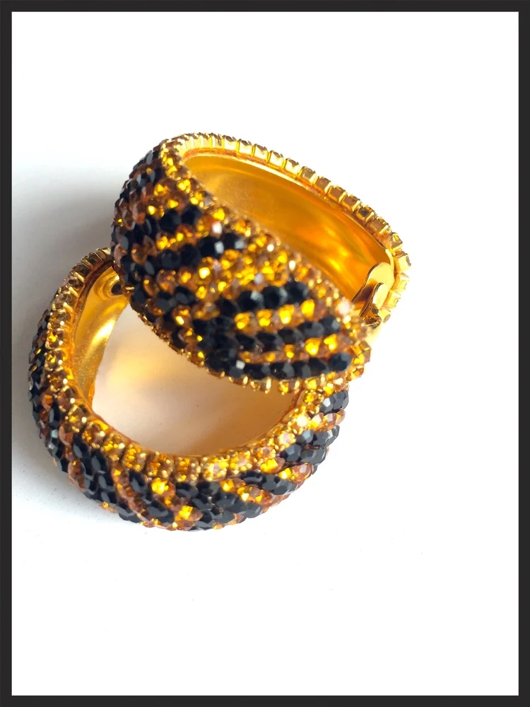 3. For the mom who loves vintage -- if she's the type who feels vintage pieces are always more special, then she'll appreciate these gorgeous vintage beaded tiger stripe clip-on earrings. They truly are special!