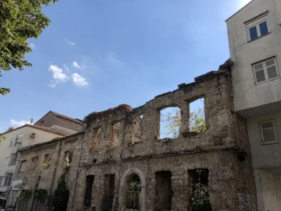 Bombed Ruin Between Two Inhabited Buildings