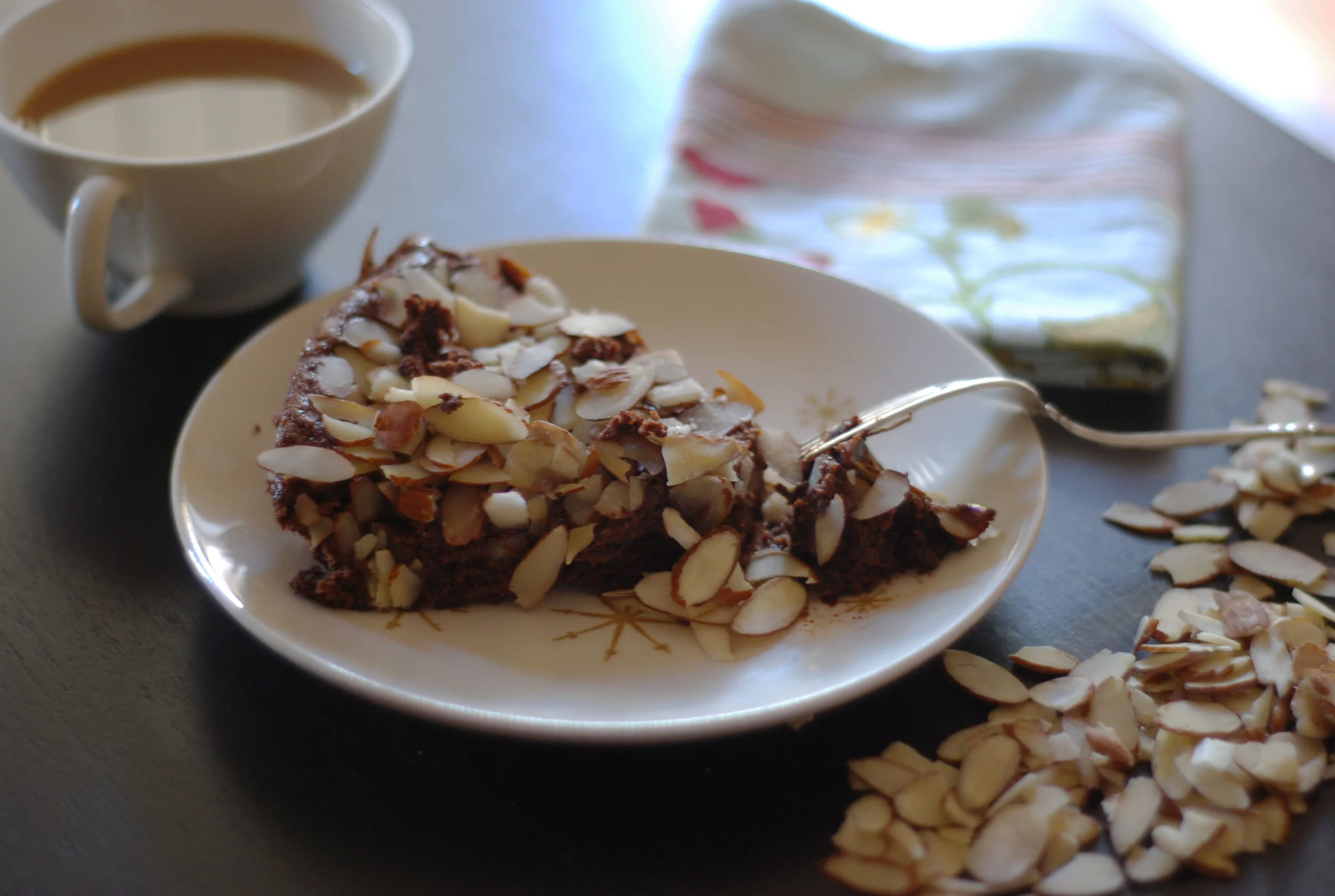 Slice of almond choc gluten-free cake.jpg