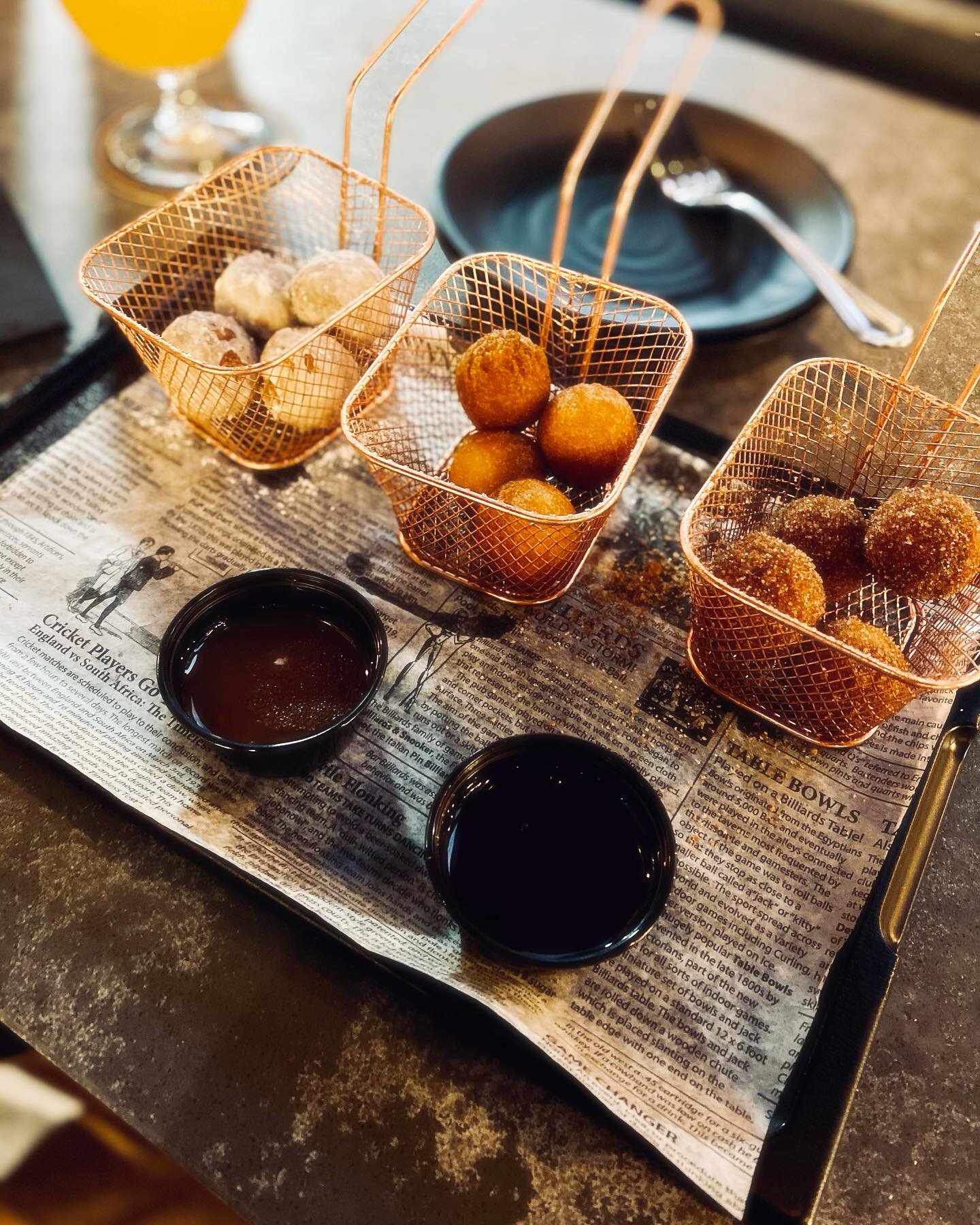 Donut hole dessert with caramel and chocolate sauces. How is this not going to be amazing. And is at @aspirebrewing