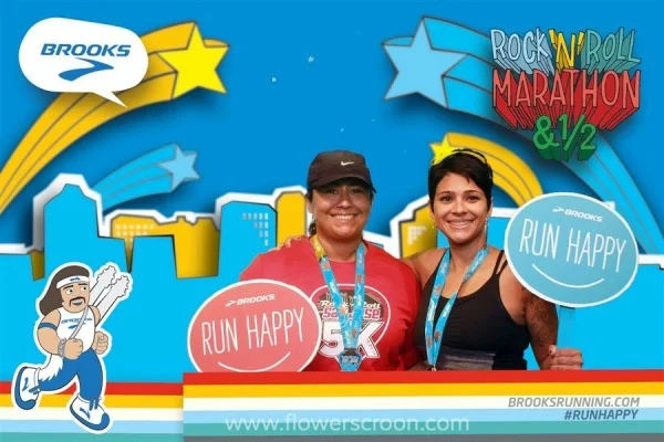 My friend Laura and I after the 5K at the Brooks photo machine inside the Expo