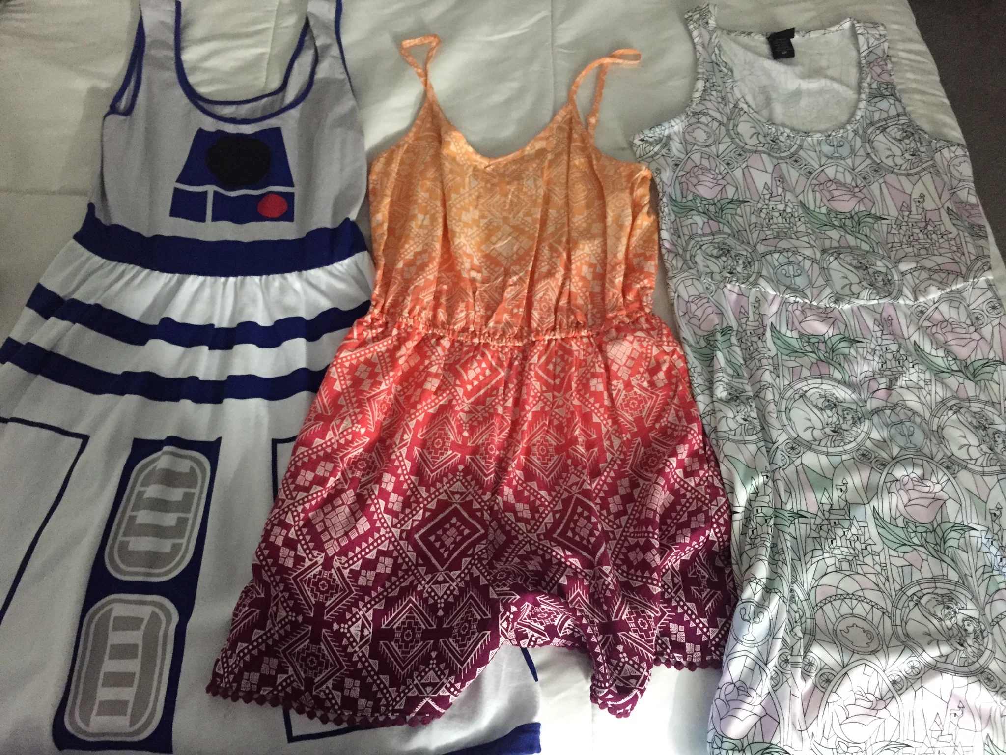L to R: R2D2 Dress (Star Wars), print romper (Adventureland), Beauty & The Beast stained glass dress (Fantasyland)