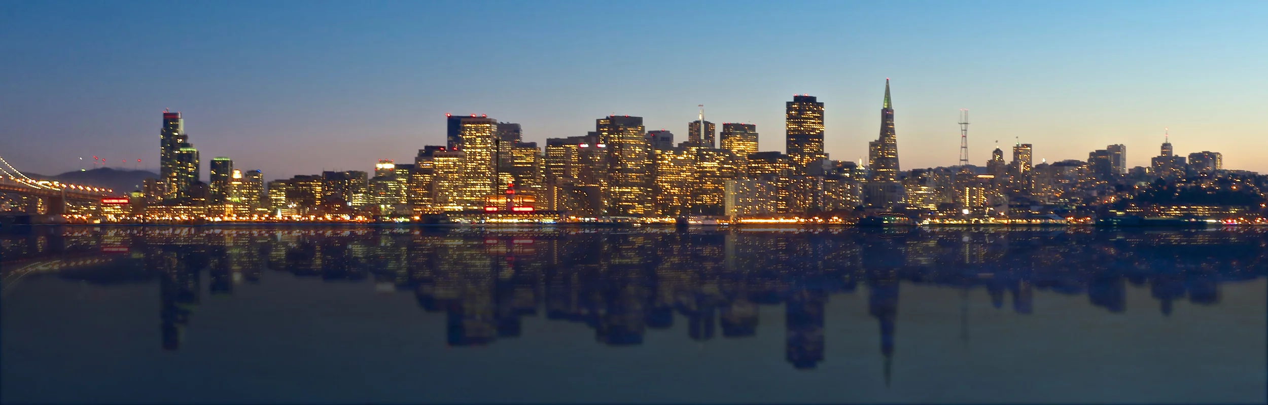 San Francisco skyline with reflection on the bay.