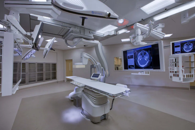 Patient Right, Foot End View: Philips FlexMove Xper Angiography Imaging System with Skytron Surgical Lights & Equipment Booms