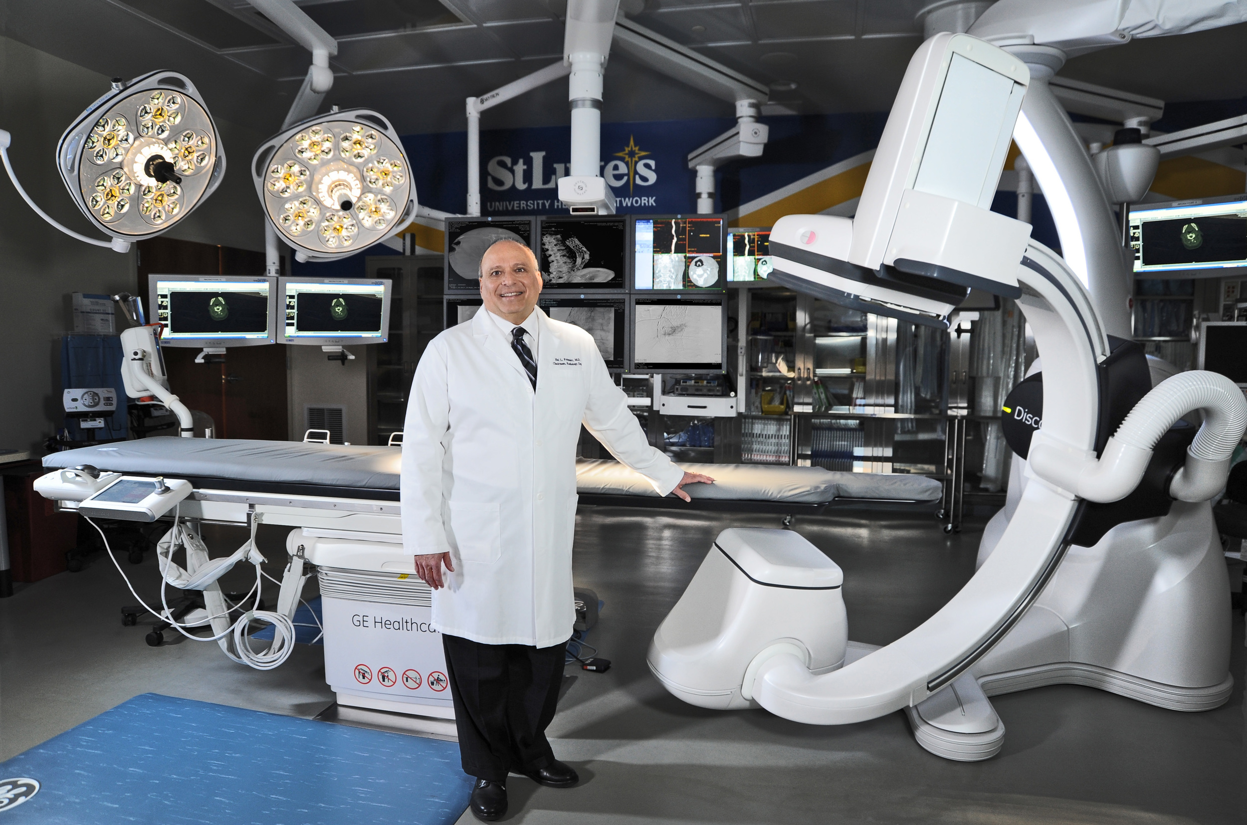 Hybrid Operaging Room featuring the GE Discovery IGS 730 imaging system, with LED surgical lights, equipment booms, and surgical monitors from SKYTRON