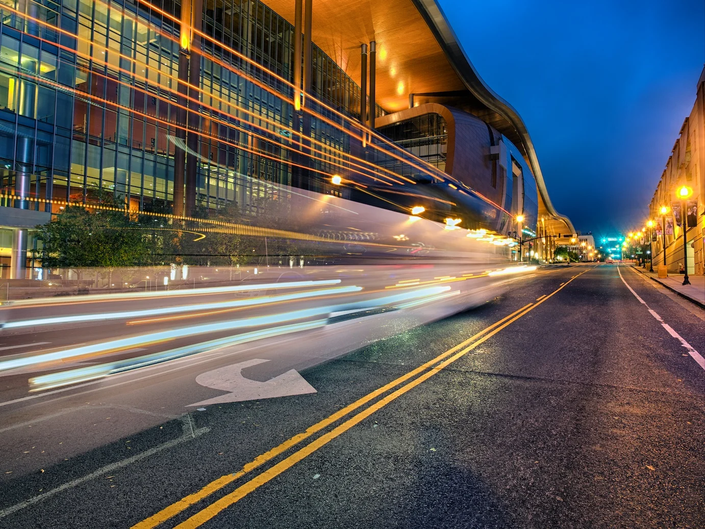A bus passes in front of the Music City Center
