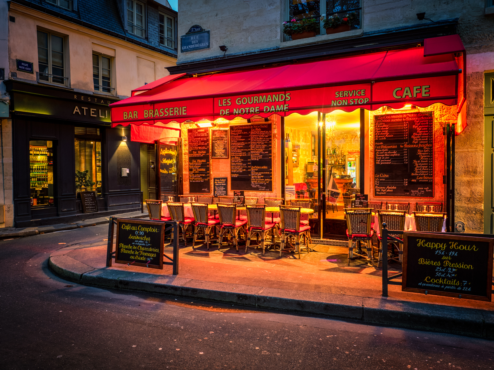 a cozy little cafe near notre dame cathedral in paris, france