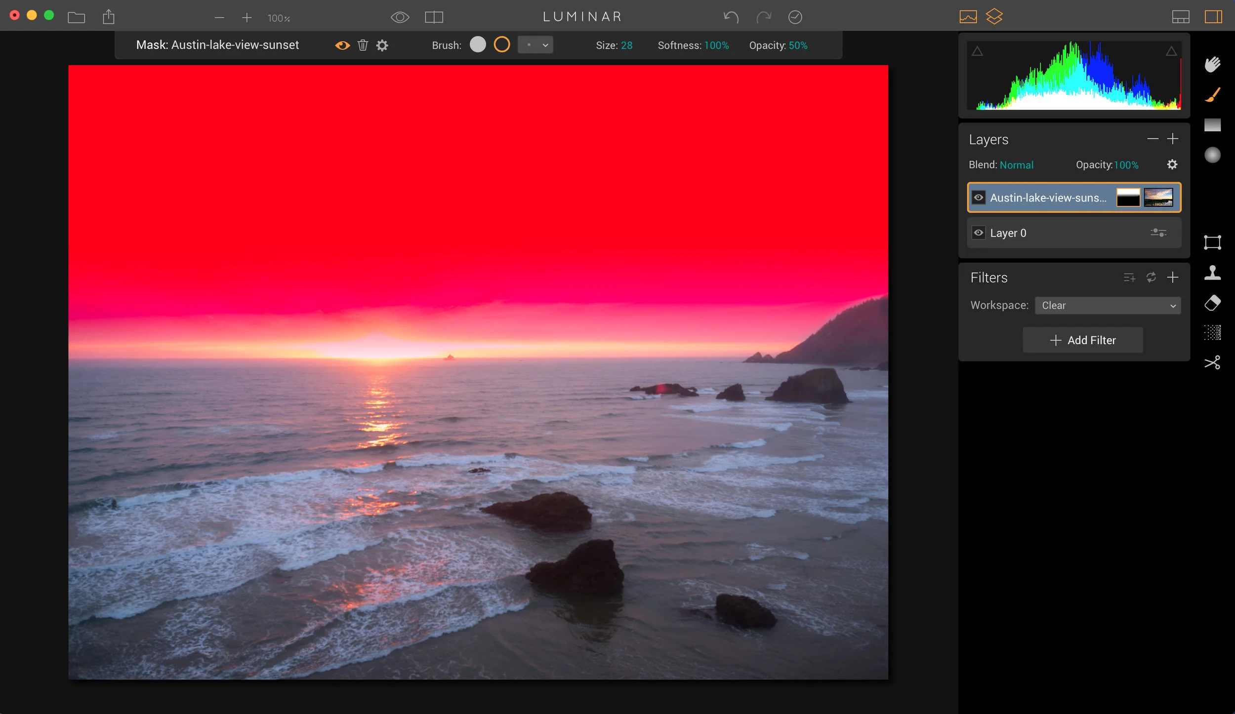 If you need to, you can then grab the eraser brush to clean up any of the blending. In this one, I erased some of the new sky from that big rock area on the right hand side about halfway up.