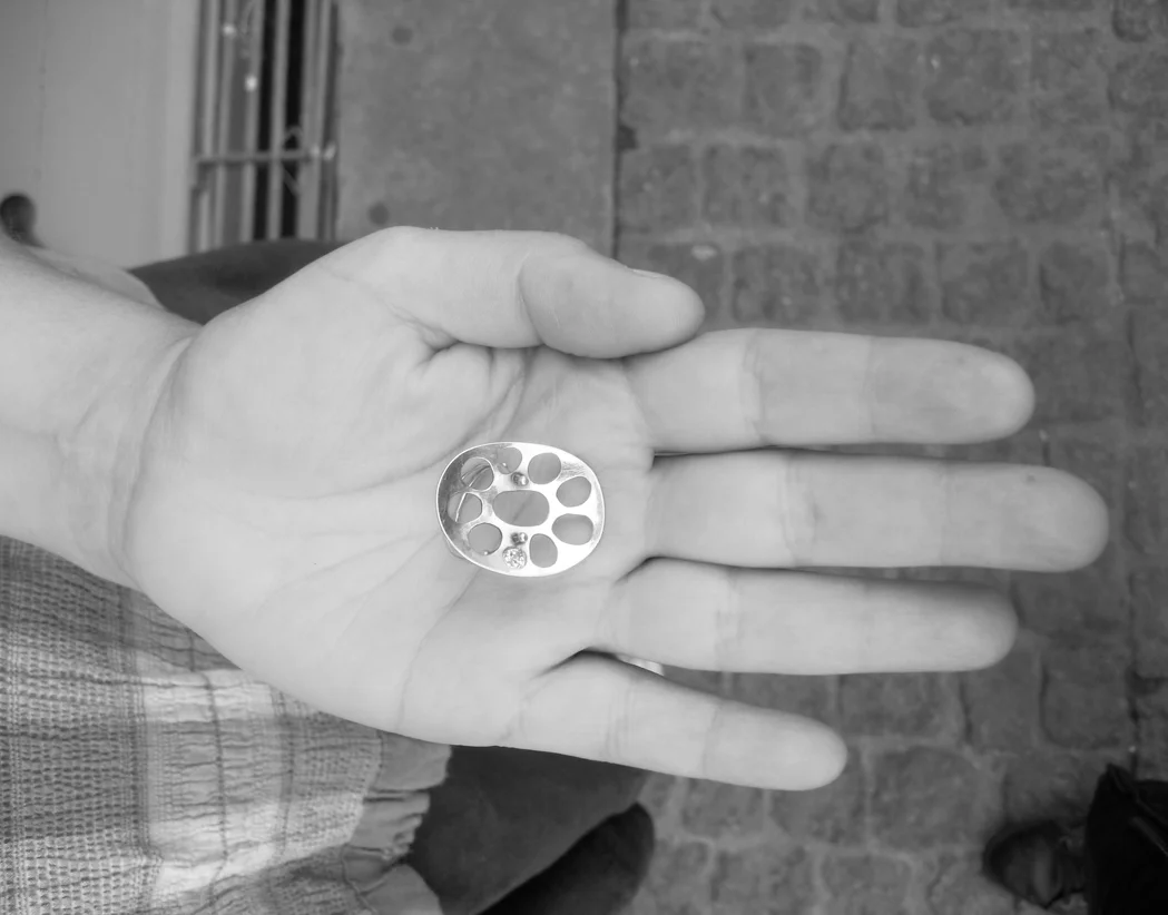  When the gold prices were reasonable, Thorkild cut out one of Kasia's drawings and transformed it into a finger ring. In the ring a hand-cut diamond is set and fits the random and spontaneous ring.  Name: Kasia.  What: Gold ring with hand cut diamon