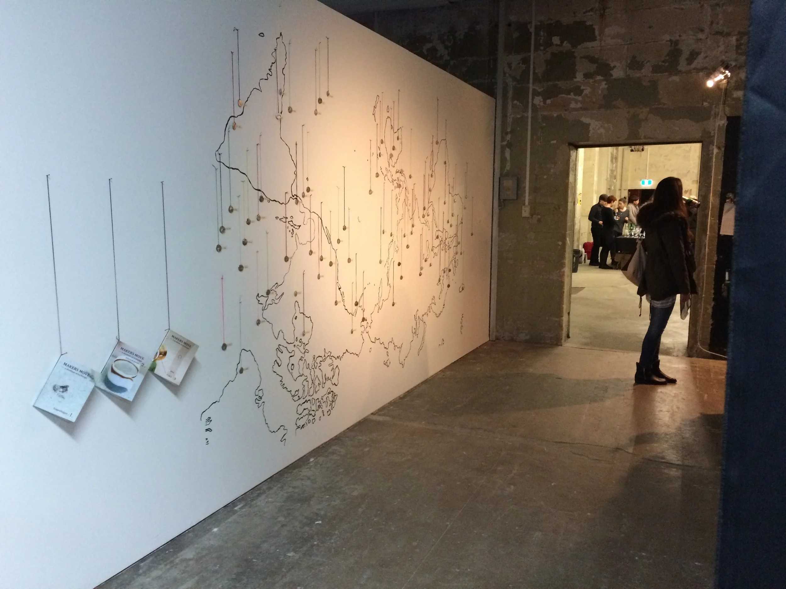  All the 92 pendants we have made within the last 3 years -&nbsp; hanging on an upside down worldmap inside SGA Galleries.    