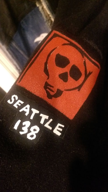 on the arm of the hoodie
