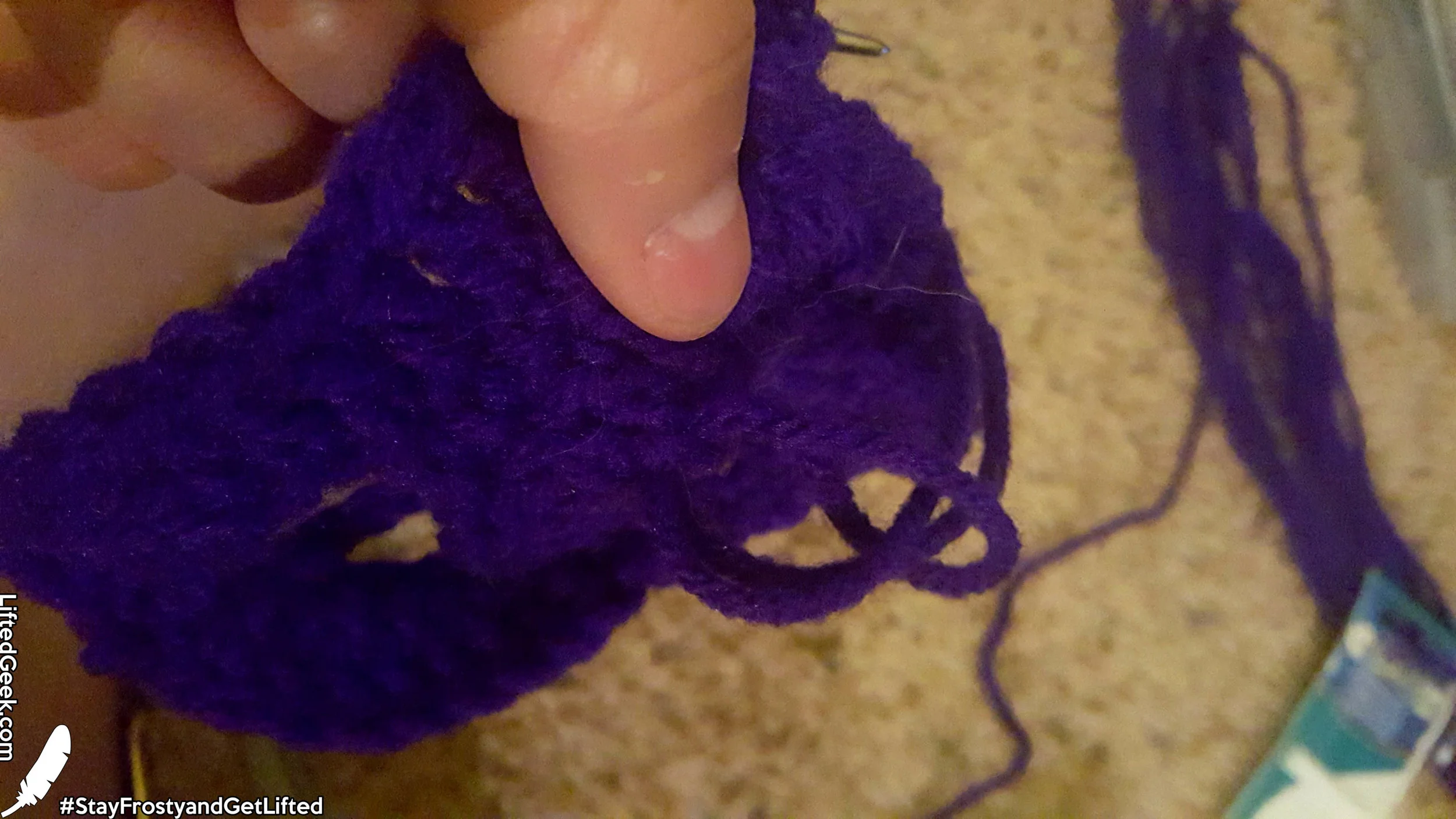 Take end pieces of string and pull through the loop