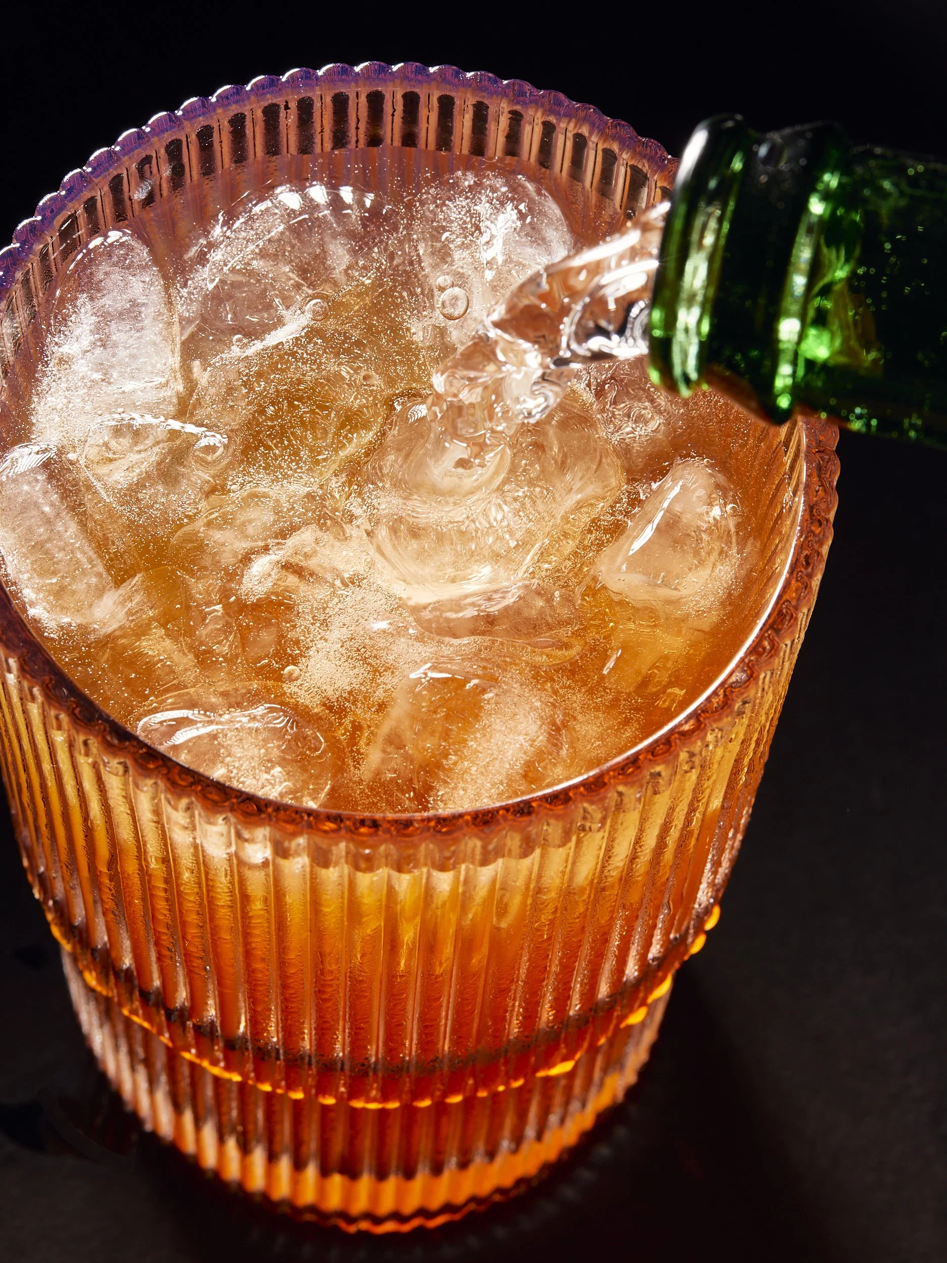 Image of a liquid pour by NYC beverage photographer EVI ABELER