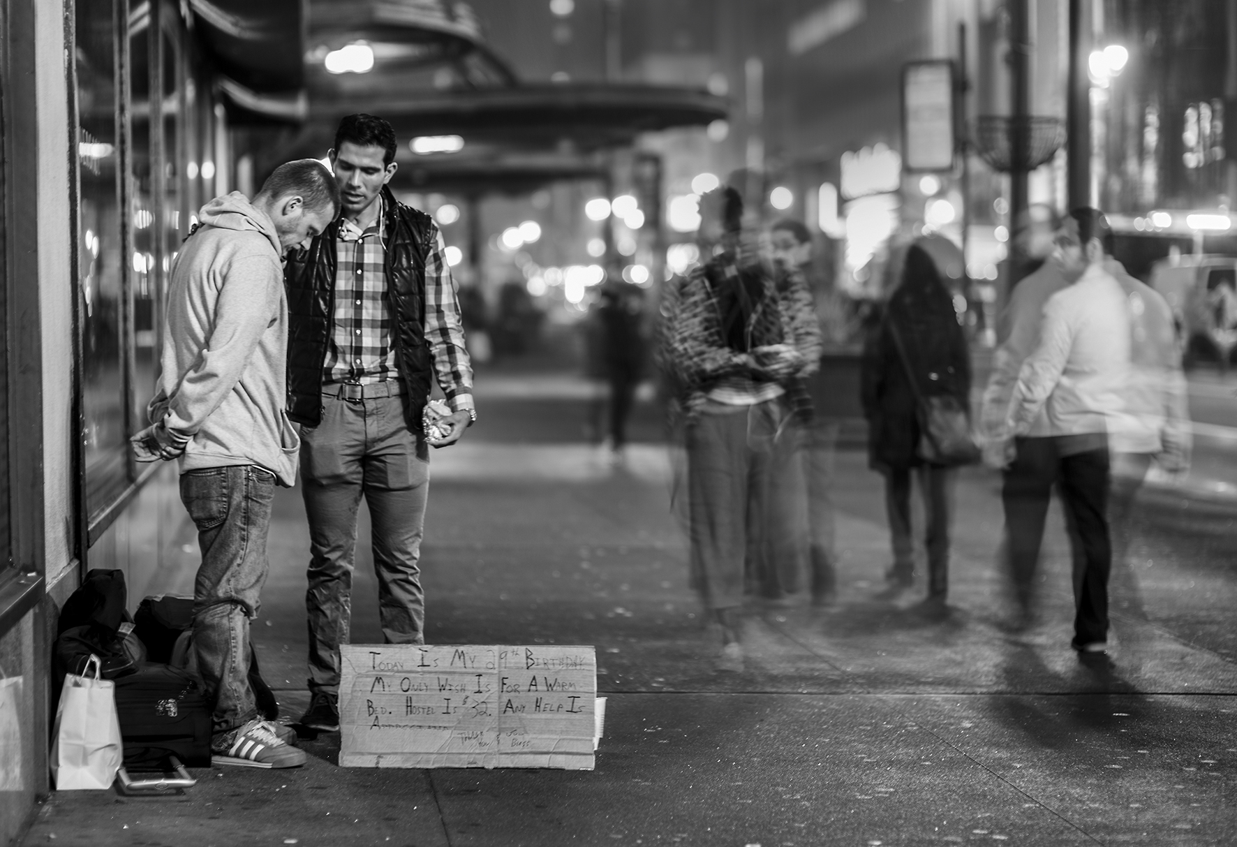 I'm walking by Madison Square Garden at 10pm. It's not too cold but it's just started to drizzle. I'm taken aback by a man who is comforting and praying over a homeless man who is spending his 29th birthday on the streets of New York. Other pedestrians turn their heads as they walk by, witnessing the humanity of one individual who stopped and gave time to someone less fortunate then themselves.