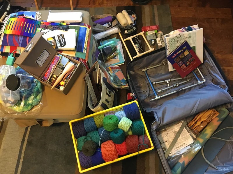 Yep, that is the pipe loom in the suitcase. Unless I change my mind (always a danger), I'm going to see if I can't do a couple four-selvedge pieces on this trip. Fingers crossed that TSA lets that one through! I will put the cones of warp in the other checked bag. They apparently look a lot like liquid and pipes and liquid together in one suitcase seems like a bad bet.