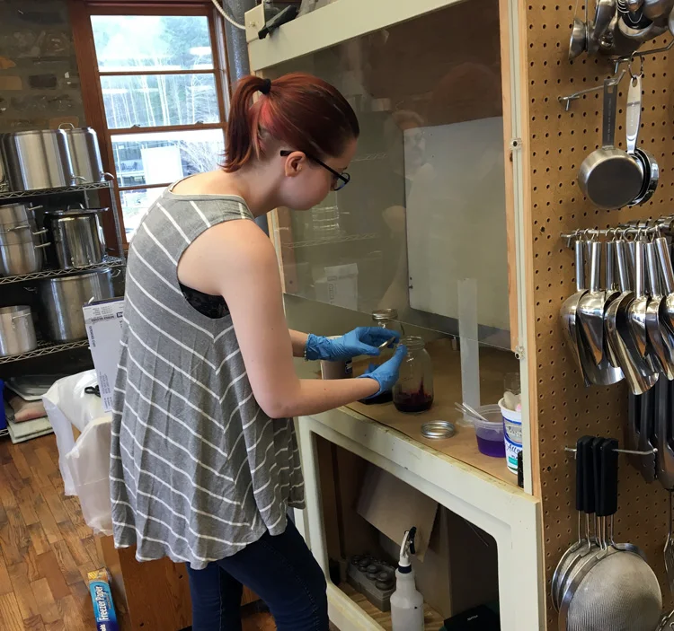 Sarah making the dye solution. Notice the great dye measure station with exhaust fan.