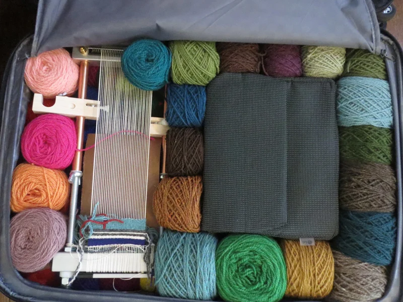 Mirrix Lani loom to the left with wooden clips turned in line with the loom. This is safer for the clips.