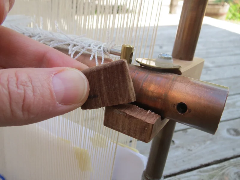 This is the weak point of the wooden clips. This is an older clip and I think the newer ones have a little more wood up front. If you have a newer loom you may never have this problem. If it does break, some superglue works quite well.