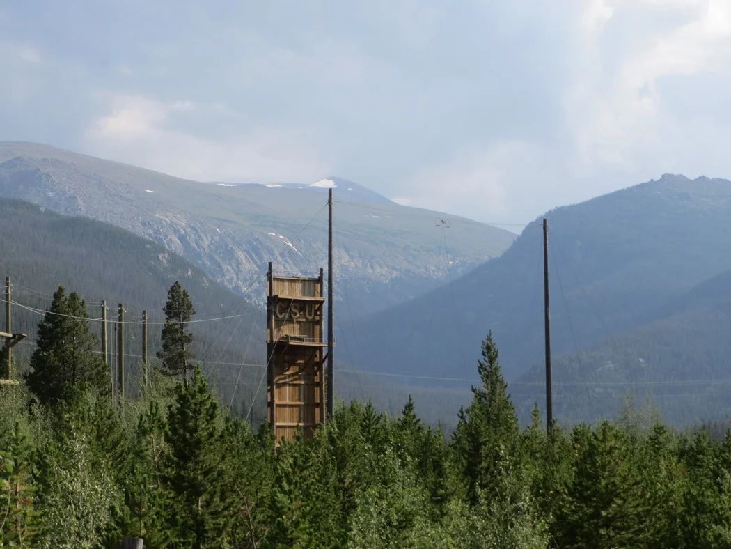 CSU Mountain Campus ropes course with Stormy Peaks behind. I will NOT be jumping from that platform to catch a swinging trapeze (nor will anyone in my group if I have anything to say about it!).