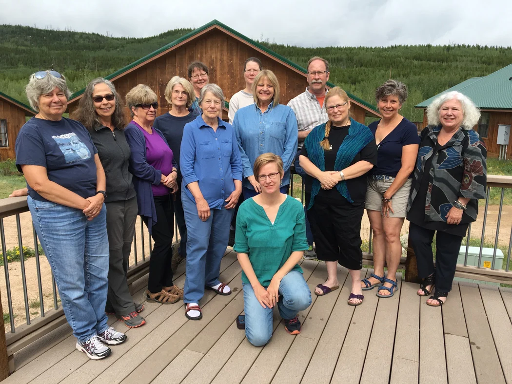 CSU Mountain Campus retreat, July 2017. The whole group left to right with me kneeling. Back row: Beverly, Liz, Beth, Susan, Kathy, Sue, Jon. Middle row: Carole, Donna, Ercil, Carol, Victoria. Not pictured: Laney.