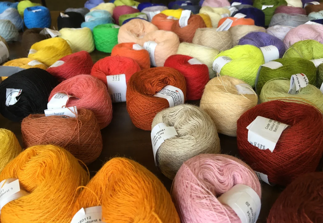 Yarn by Weaver's Bazaar. Yes, they are in the UK but shipping of their yarn to the USA is remarkably inexpensive considering the ocean in between. This yarn is wonderful for this kind of weaving on little looms.