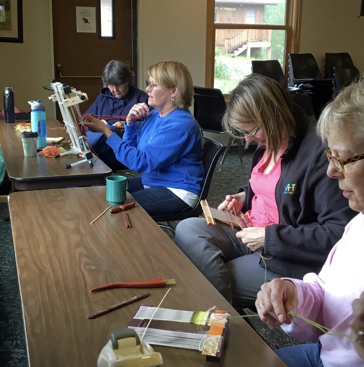 Ute, Marilyn S., Carol, and Cynthie weaving
