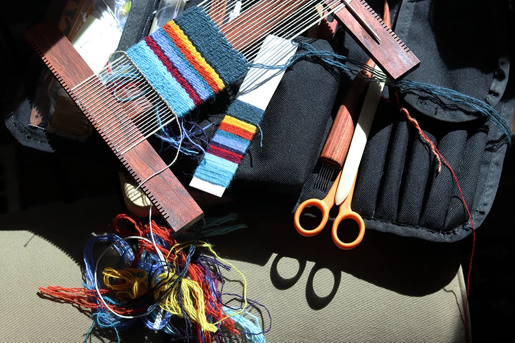 Yarn wrap used to plan stripes for three different striped weavings at different setts. Rebecca Mezoff.